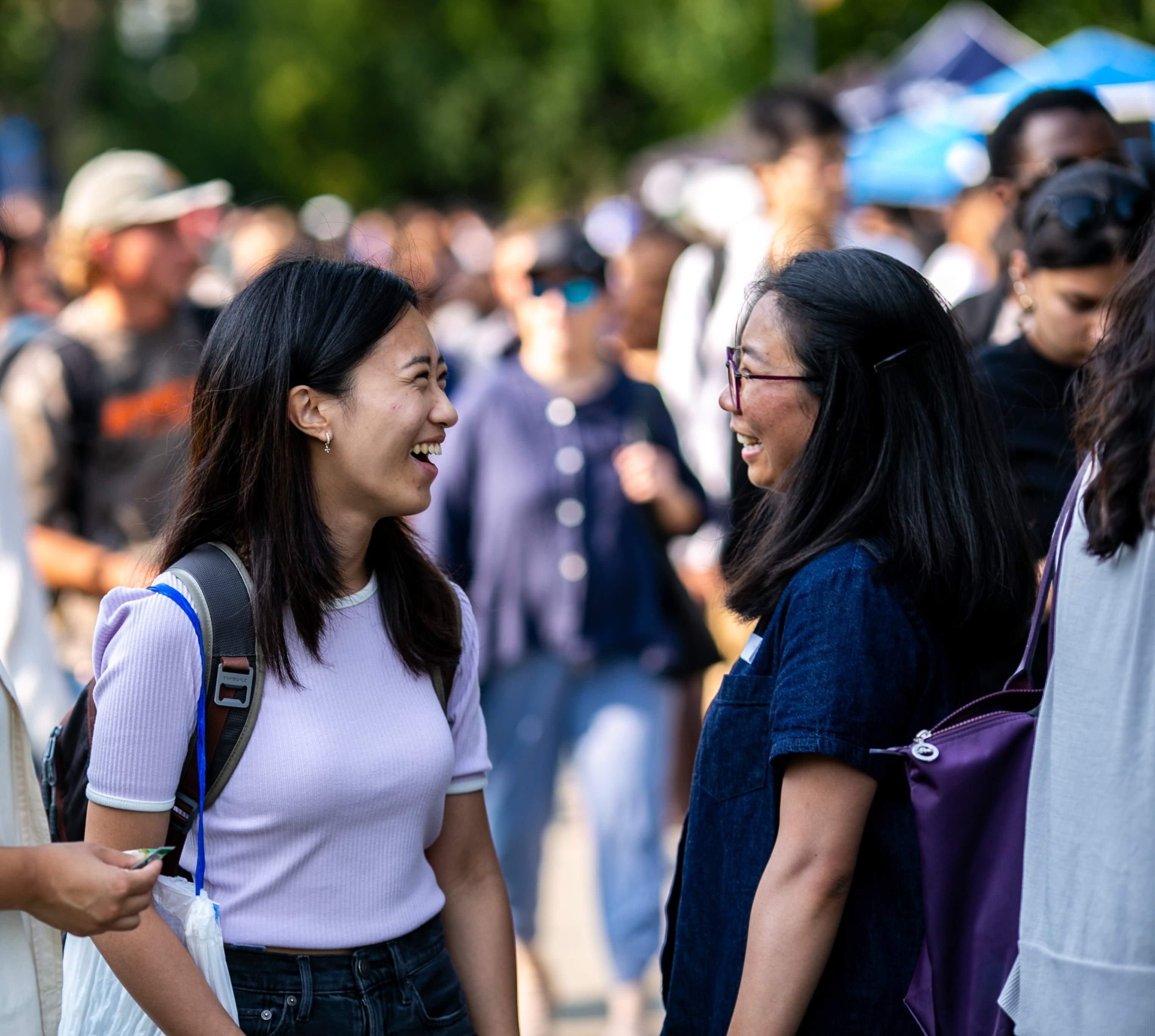 Two university students talking together on campus